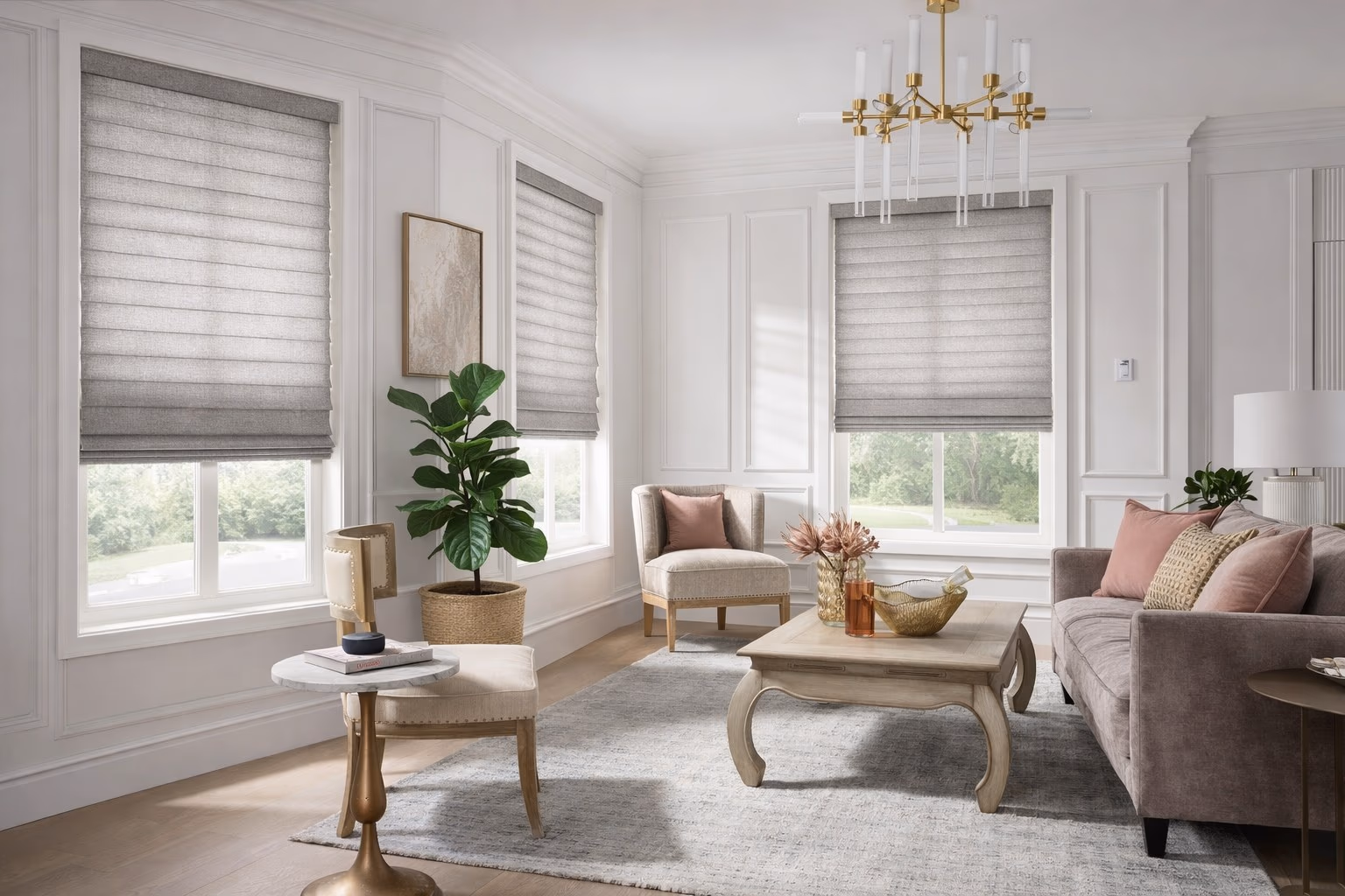 Hunter Douglas Vignette Roman Shades with tailored fabric folds in a formal living room with crystal chandelier white wainscoting and pink accent pillows, installed by Discount Best Blinds and Shutters